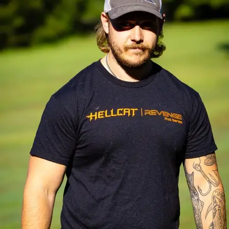 Catch The Fever Marketing Director Dillon Weaver wearing a black Hellcat Revenge® T-shirt with orange Hellcat logo.